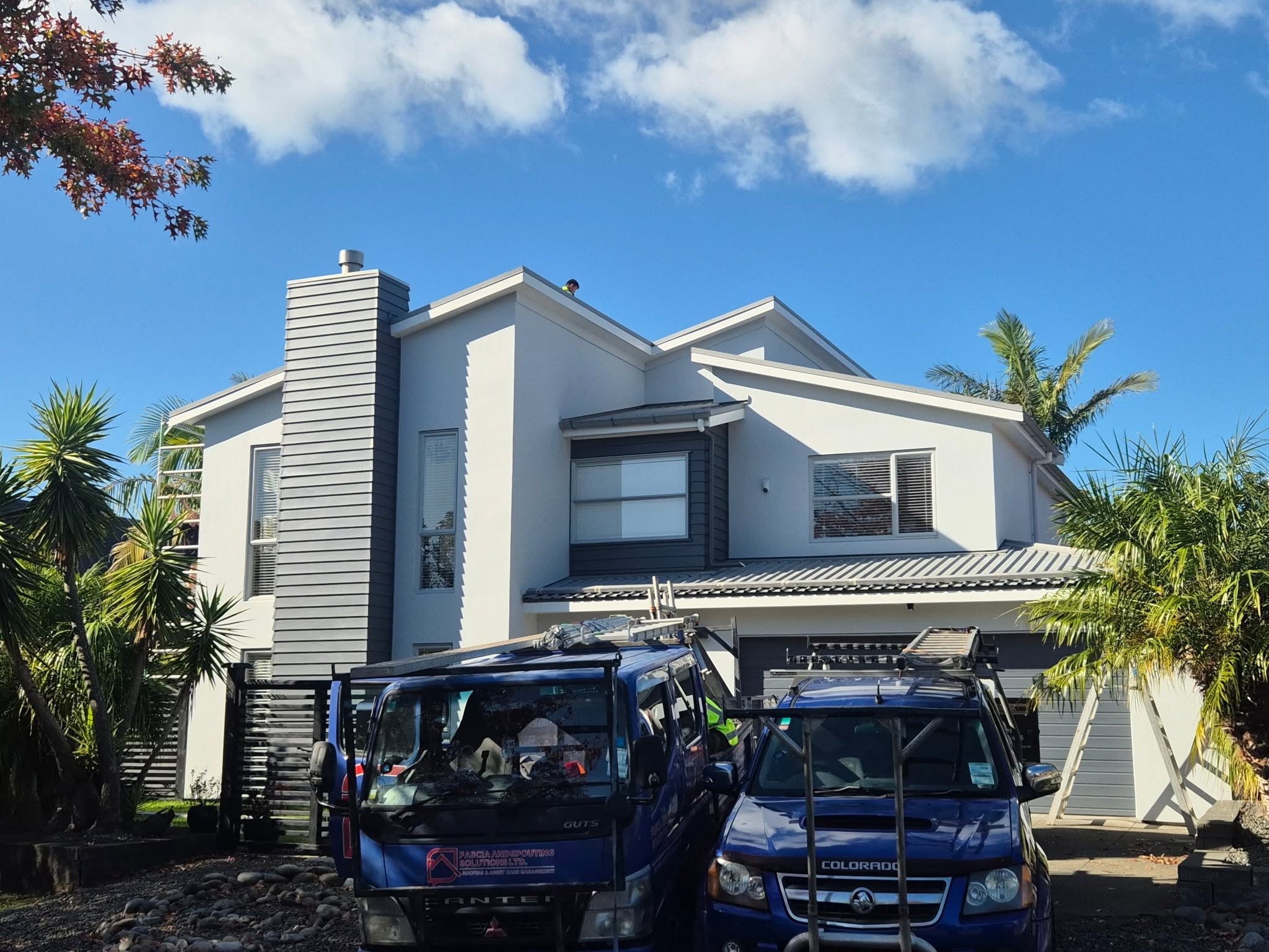Fascia and Spouting Solutions truck and crew on site, Auckland